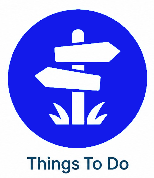 Blue circular sign with white directional arrows and the text “Things To Do” below.