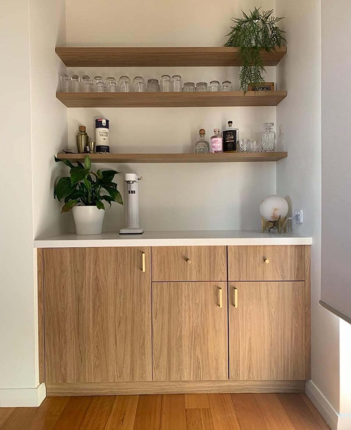Custom bar cabinet with floating shelves installed in Perth.