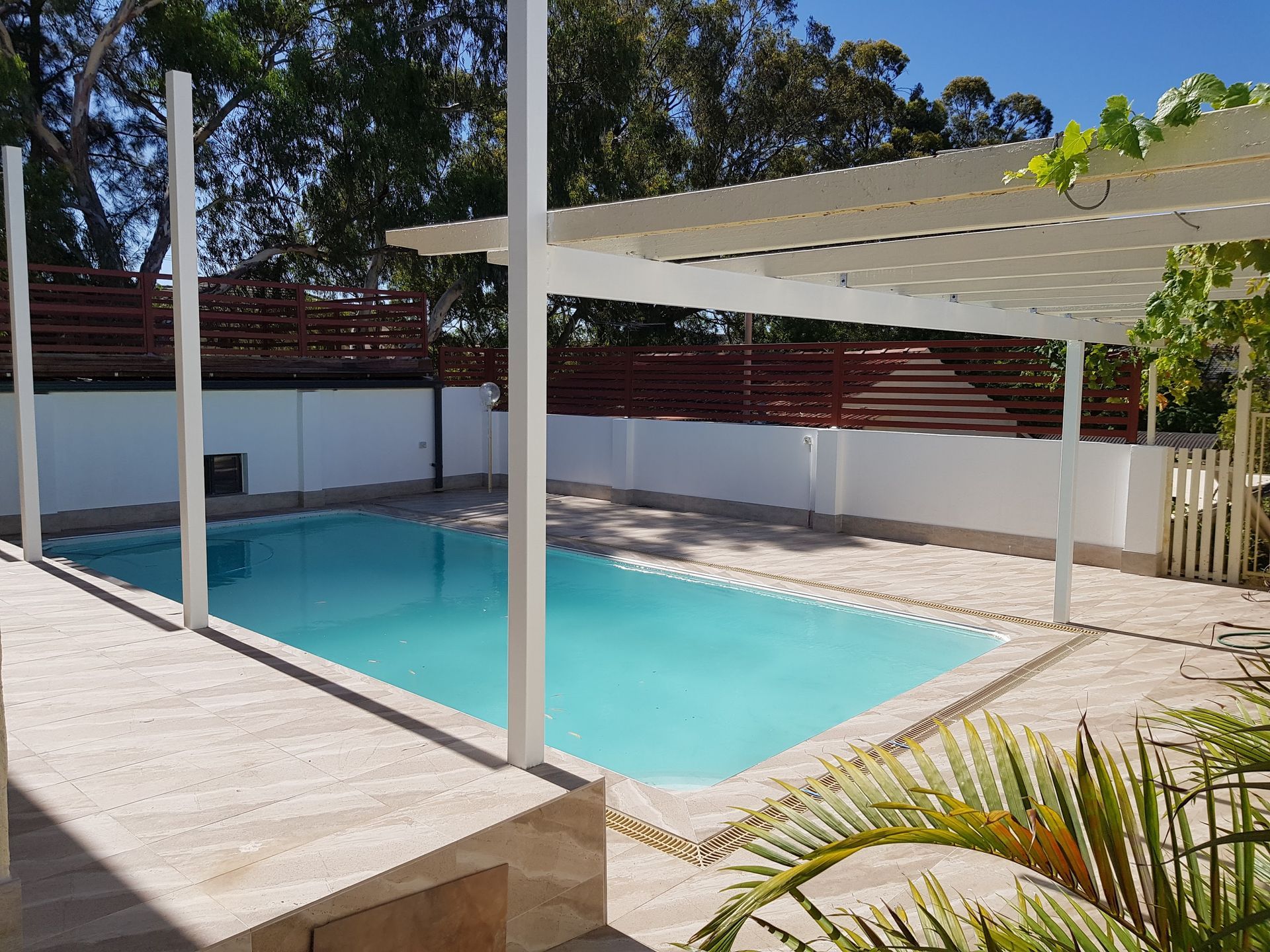 slip resistant tiles installed around a pool in Perth.