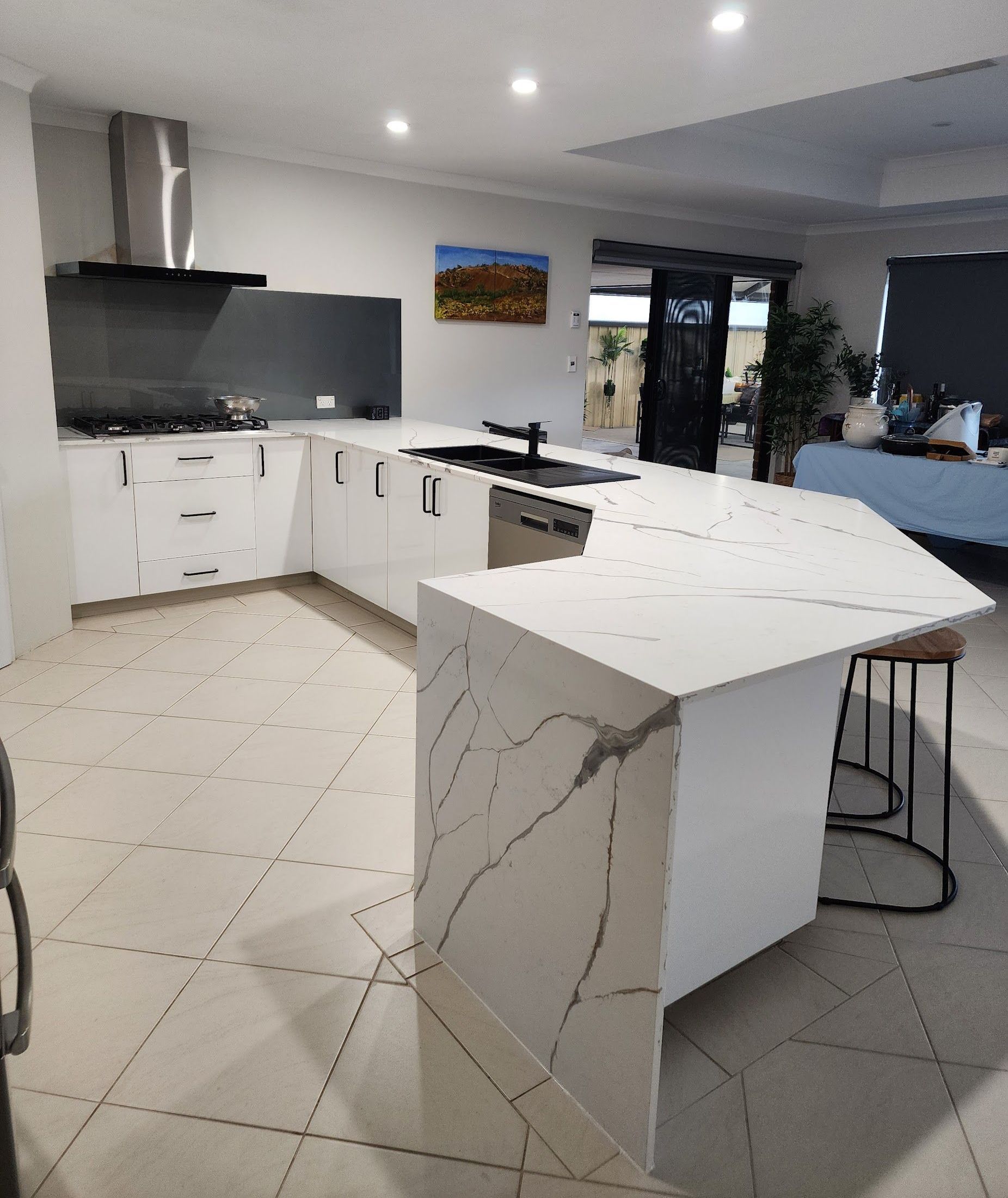Modern white kitchen withmarble look stone bench top installed in Perth.