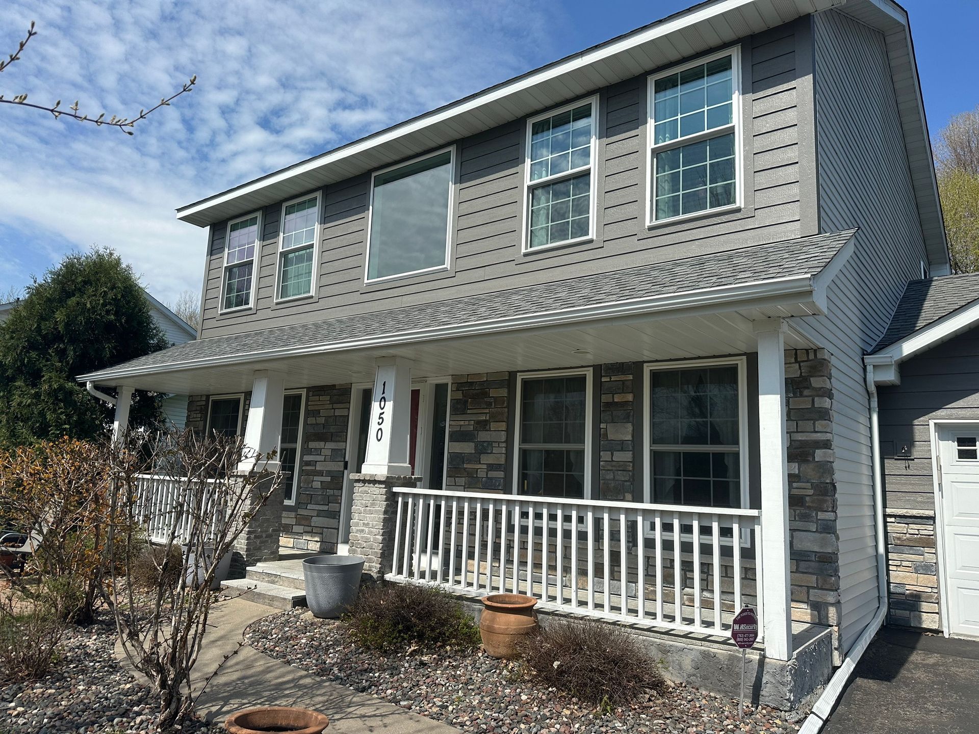 A house with a porch and a lot of windows