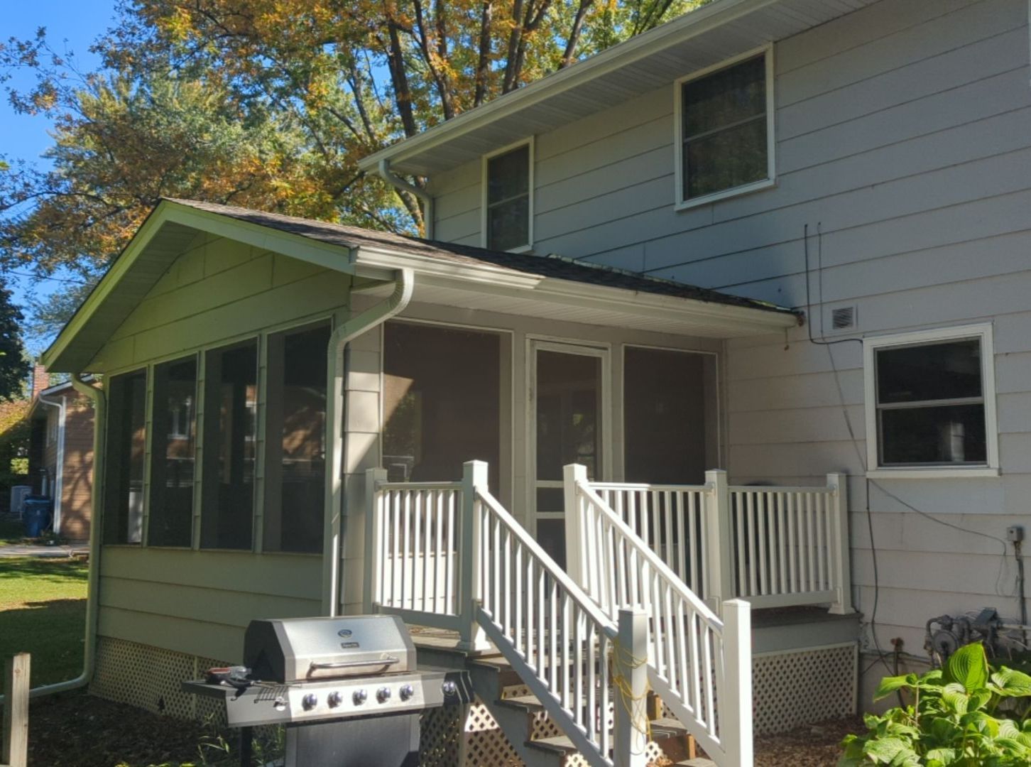 There Is a Grill on The Porch of A House — Carver, MN — TJ Exteriors Inc.