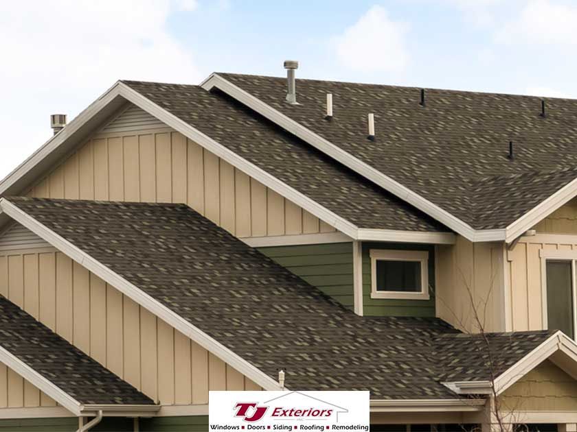 Experienced roofing crew working on a complete roof replacement for a residential home.