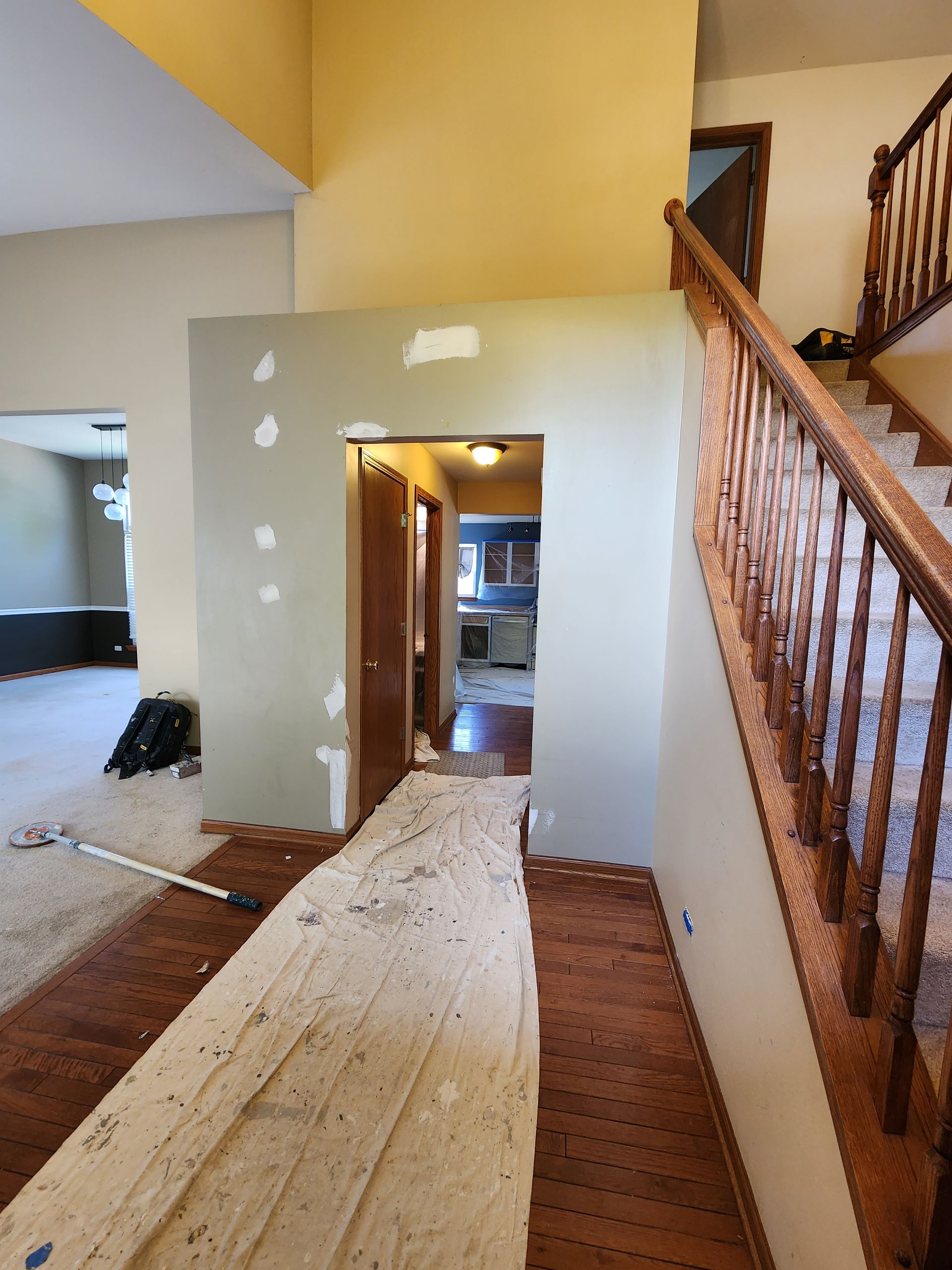 A staircase in a house with a wooden railing