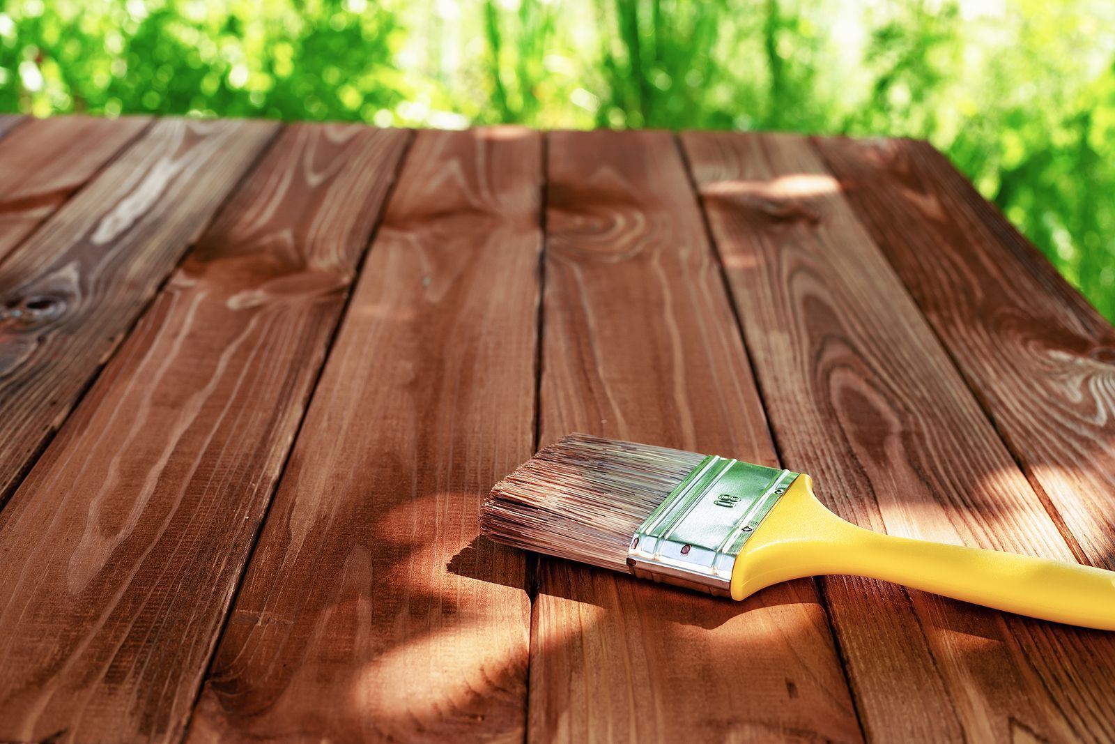 brush on wooden deck