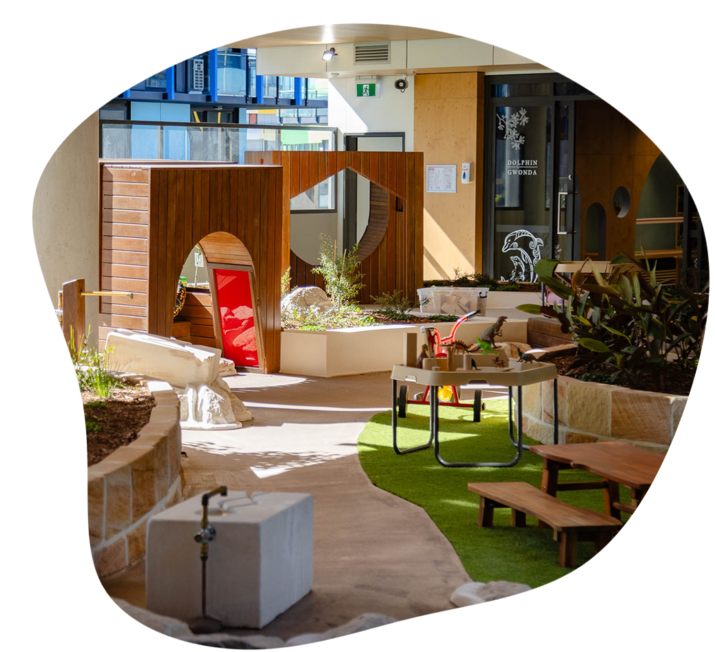 A premium outdoor childcare yard with sandpit and tunnels