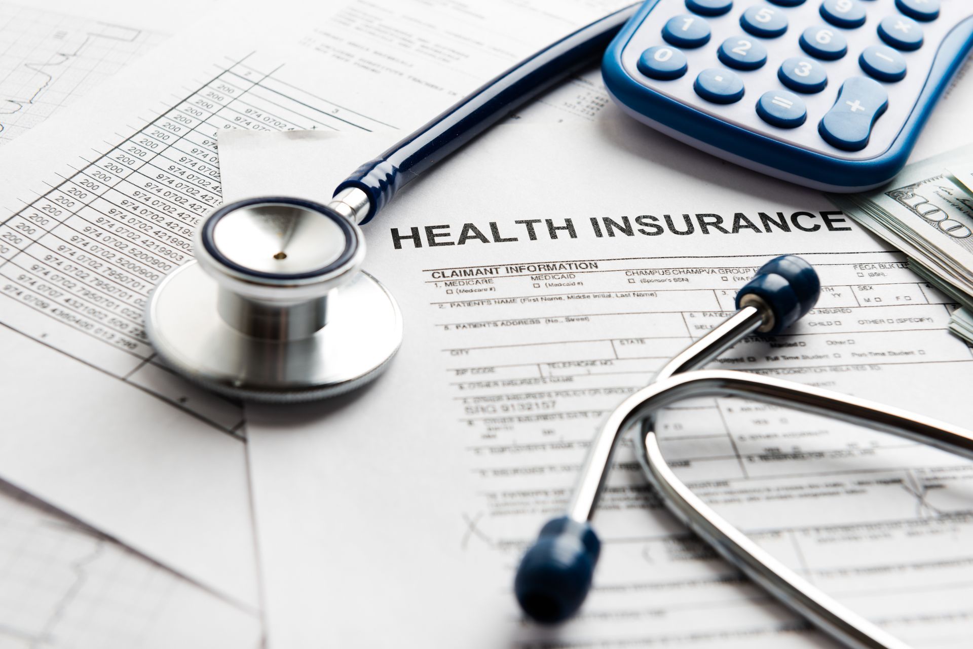 Health care costs. Stethoscope and calculator symbol for health care costs or medical insurance.