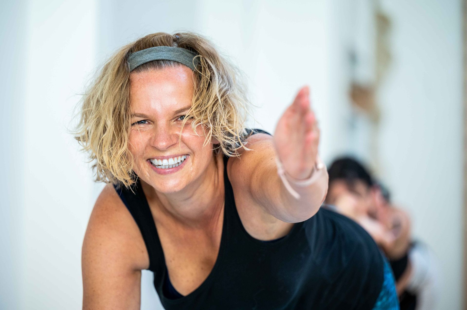 Smiling woman at yoga space Brussels