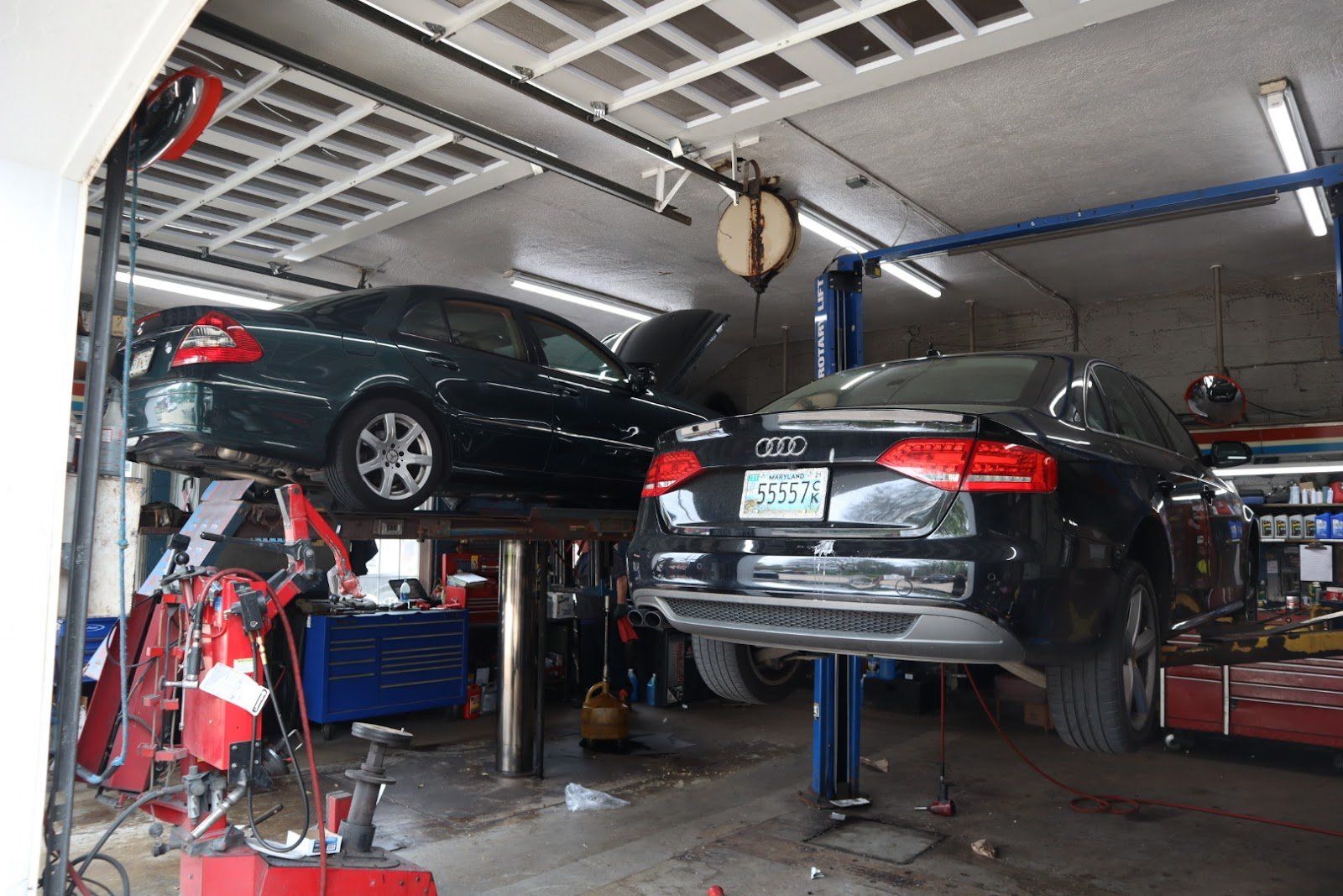 Two Mechanics Inspecting Car — Chevy Chase, MD — Lake Liberty