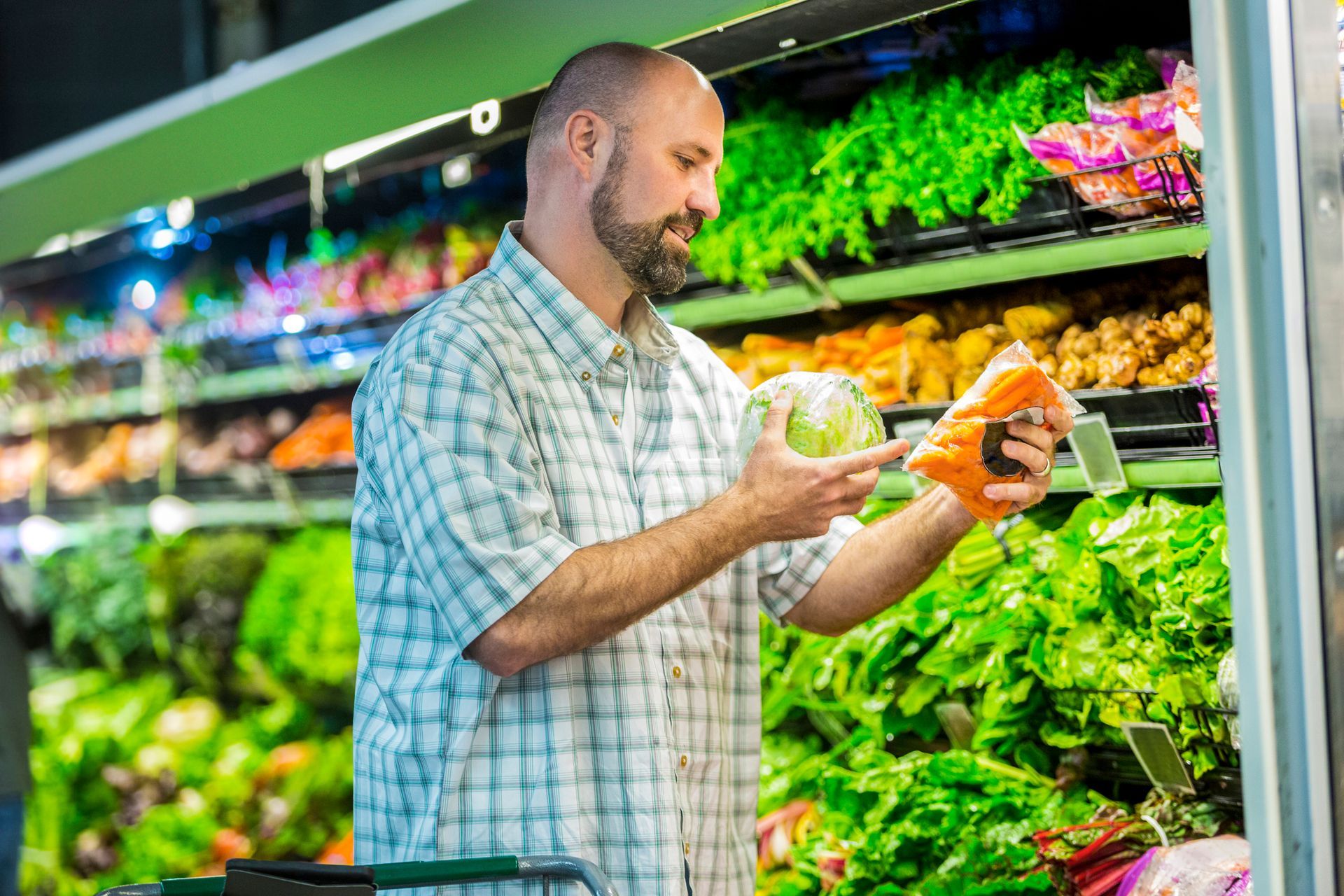 A man is shopping for healthy food options A man is shopping for healthy food options