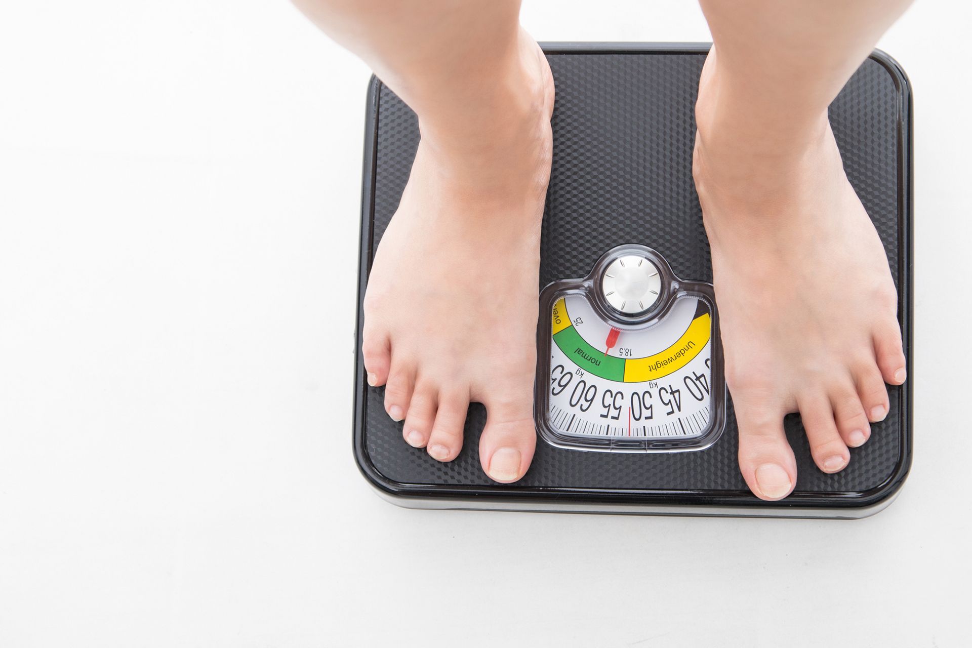 Image showcasing a person checking weight, representing medical weight loss services benefits. Image showcasing a person checking weight, representing medical weight loss services benefits.