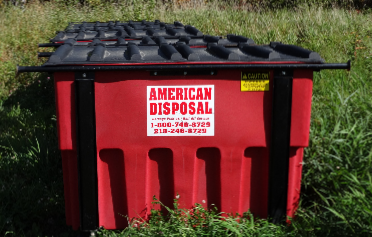 Small Red Dumpster — Deer River, MN — American Disposal Small Red Dumpster — Deer River, MN — American Disposal