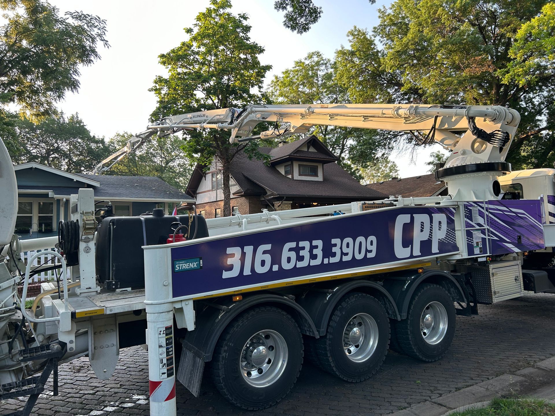 A cpp truck is parked in front of a house