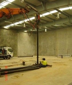 Contractor working on Indoor Screw Piling. Contractor working on Indoor Screw Piling.
