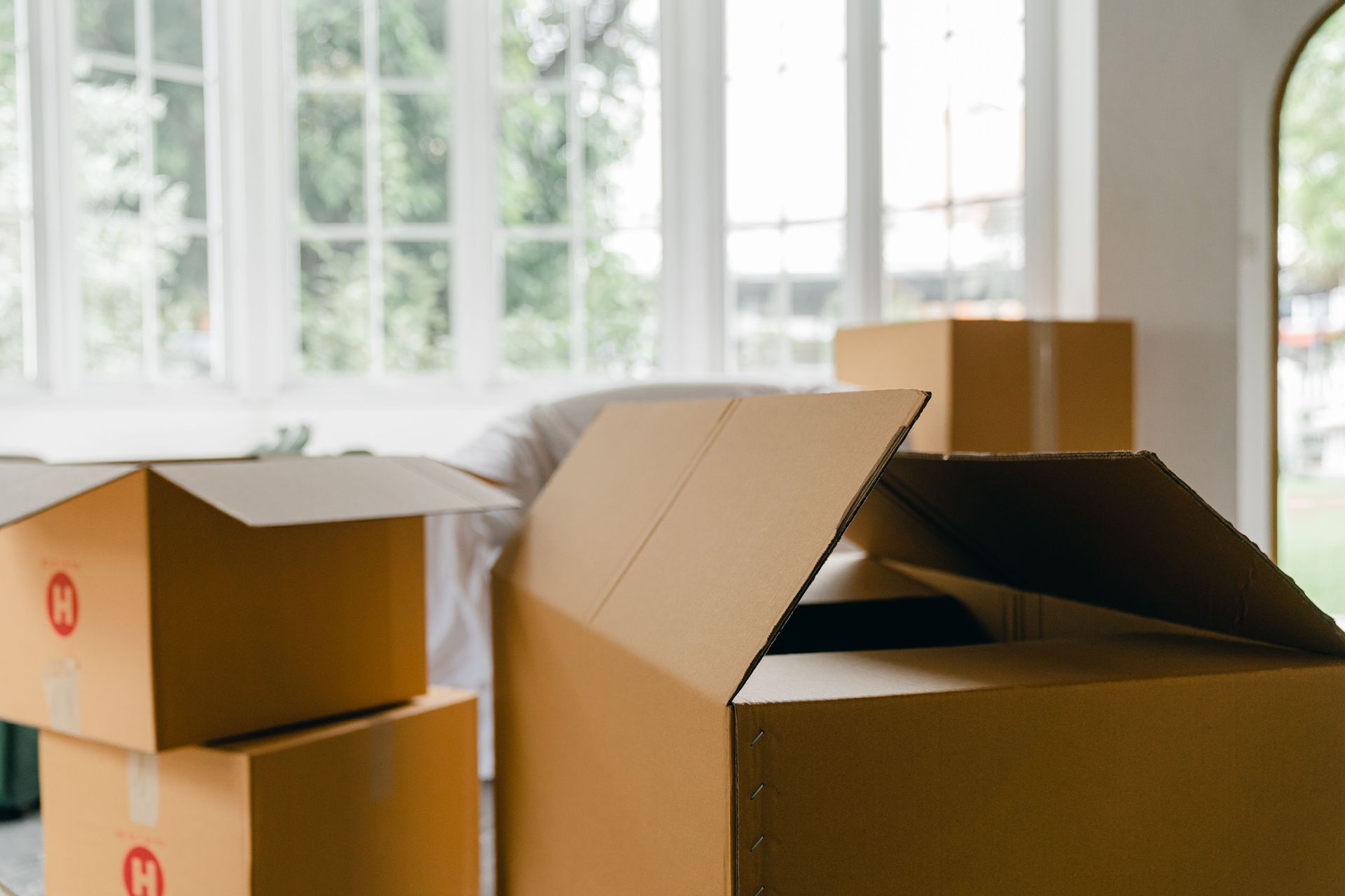A room with boxes signifies an impending move