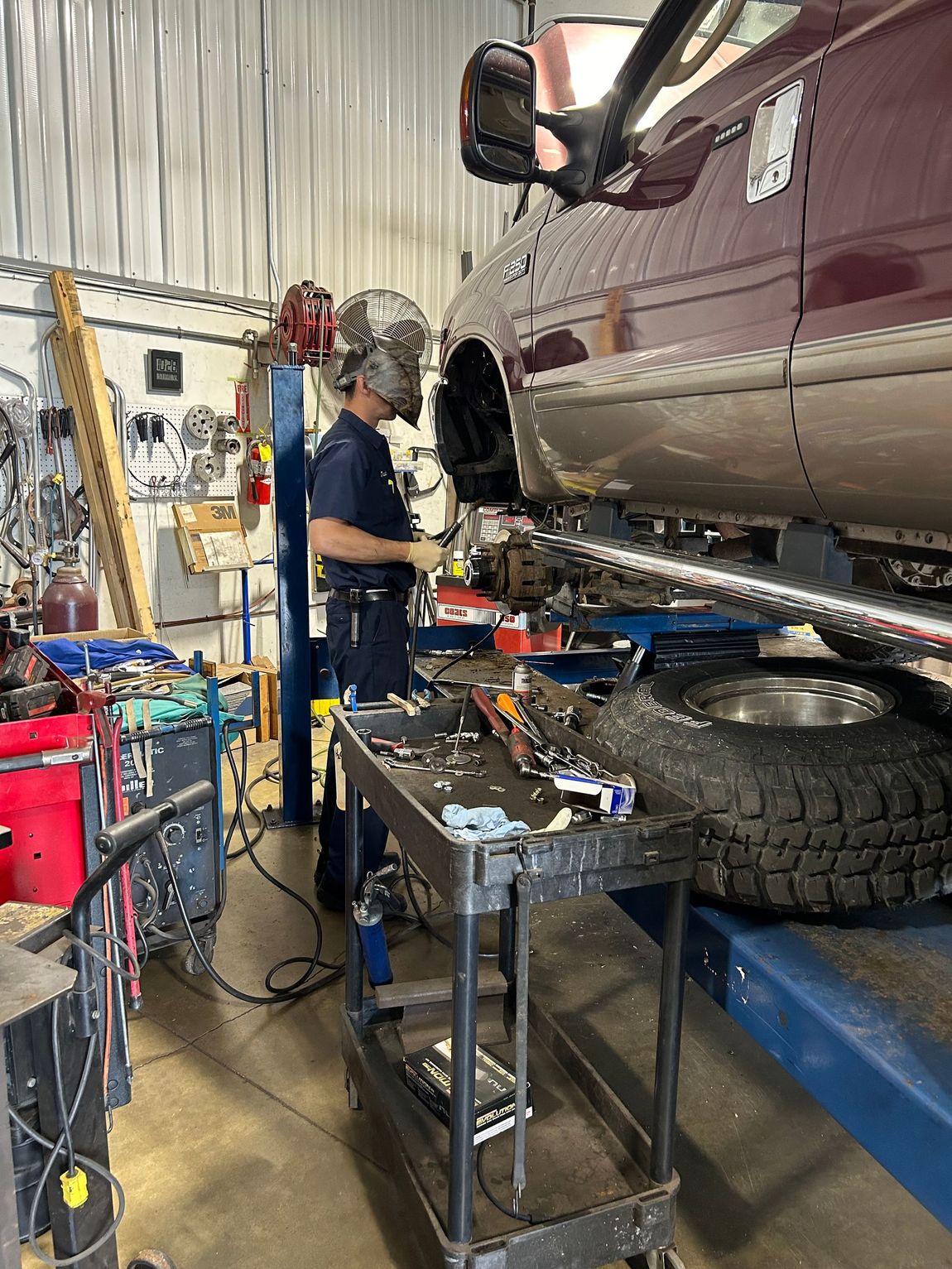 Mechanic at work under car