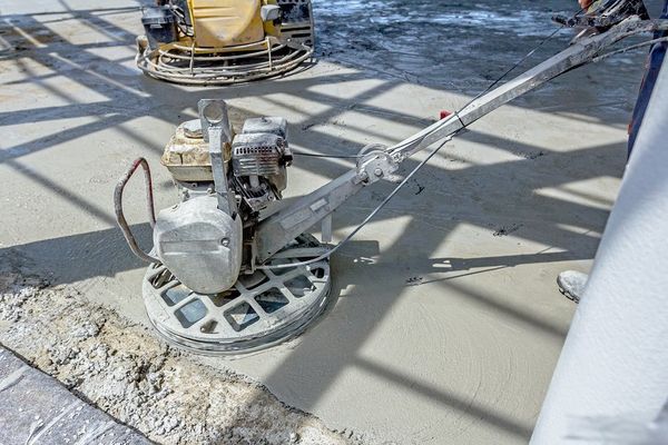man working on concrete surface