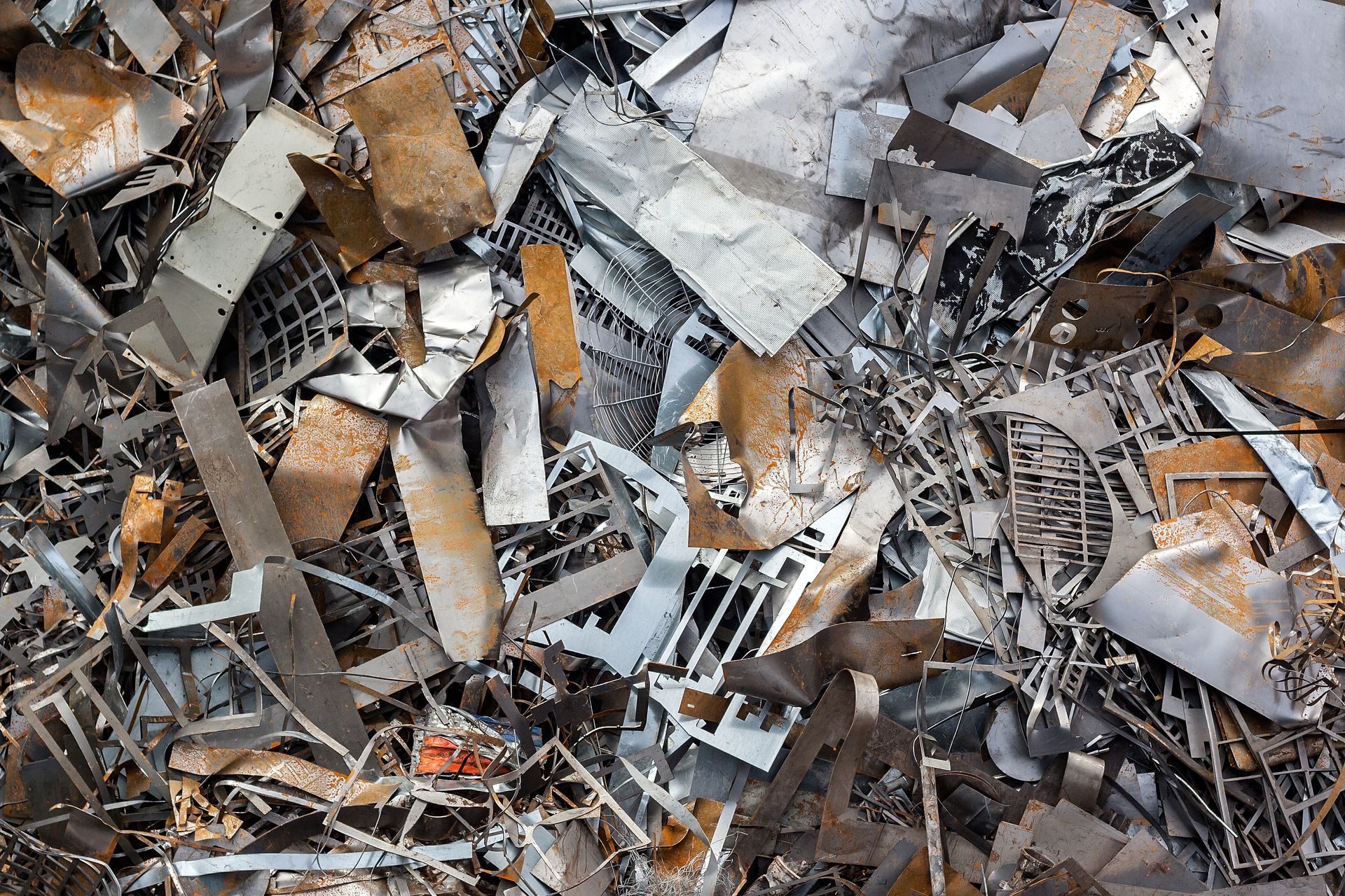 Ferrous scrap and metal mechanisms from above, showcasing aluminum scrap recycling processes. Ferrous scrap and metal mechanisms from above, showcasing aluminum scrap recycling processes.