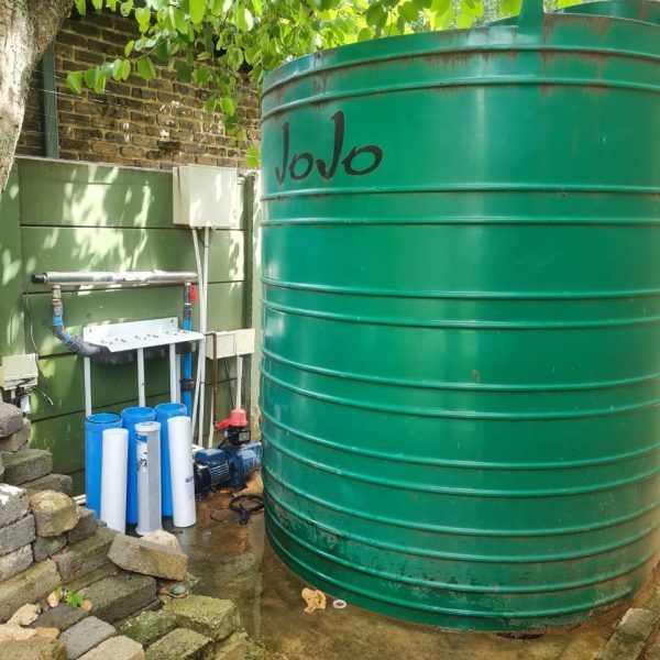 A large green tank with the word jojo written on it
