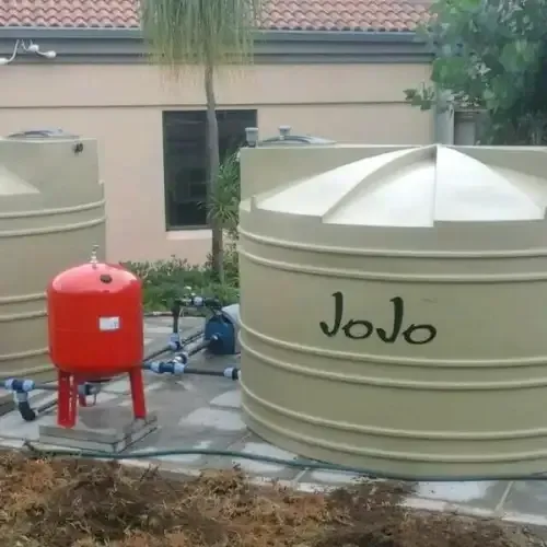 A couple of water tanks with the word jojo written on them.