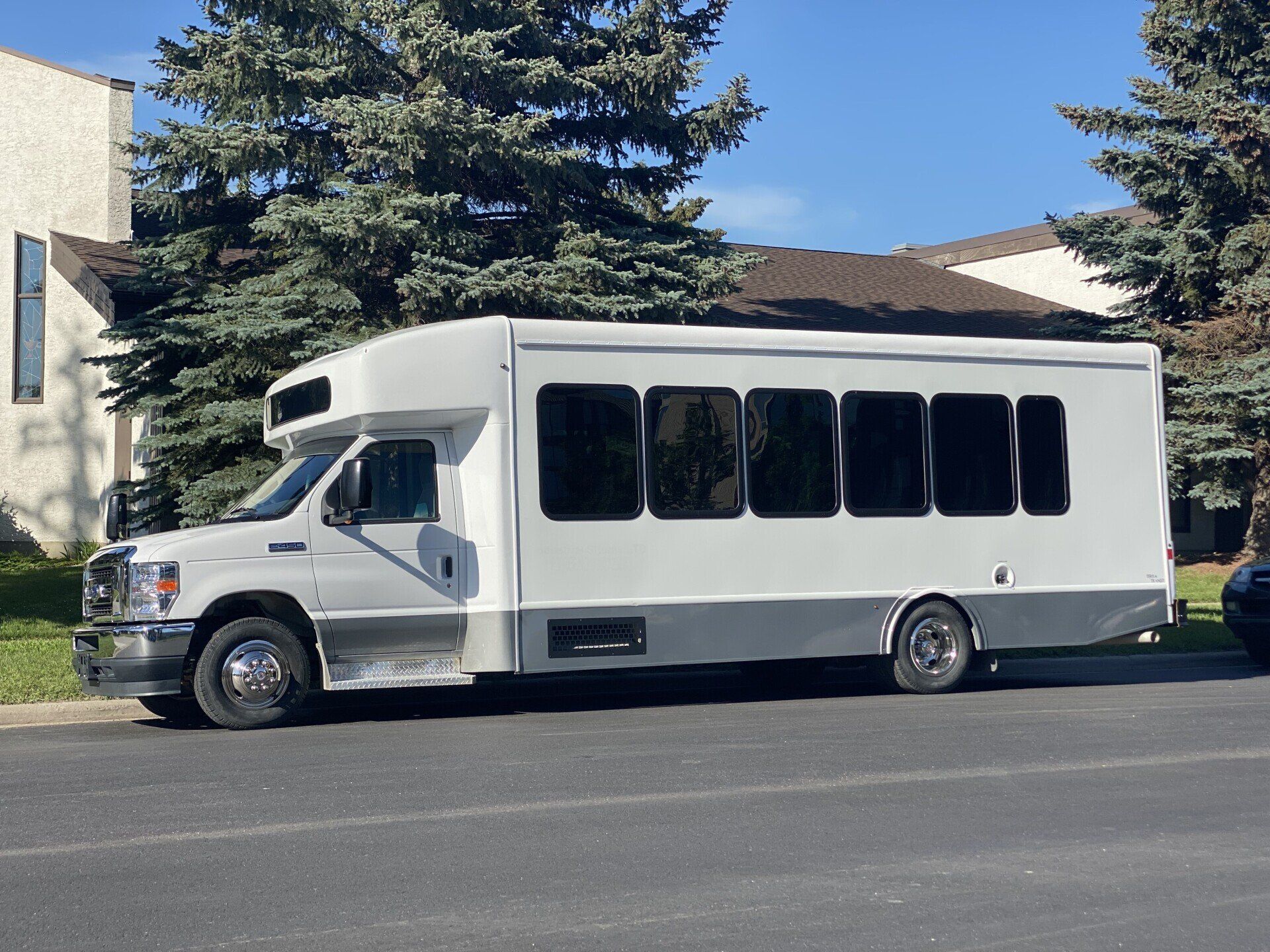 Limo To Go white executive 24 passenger shuttle bus