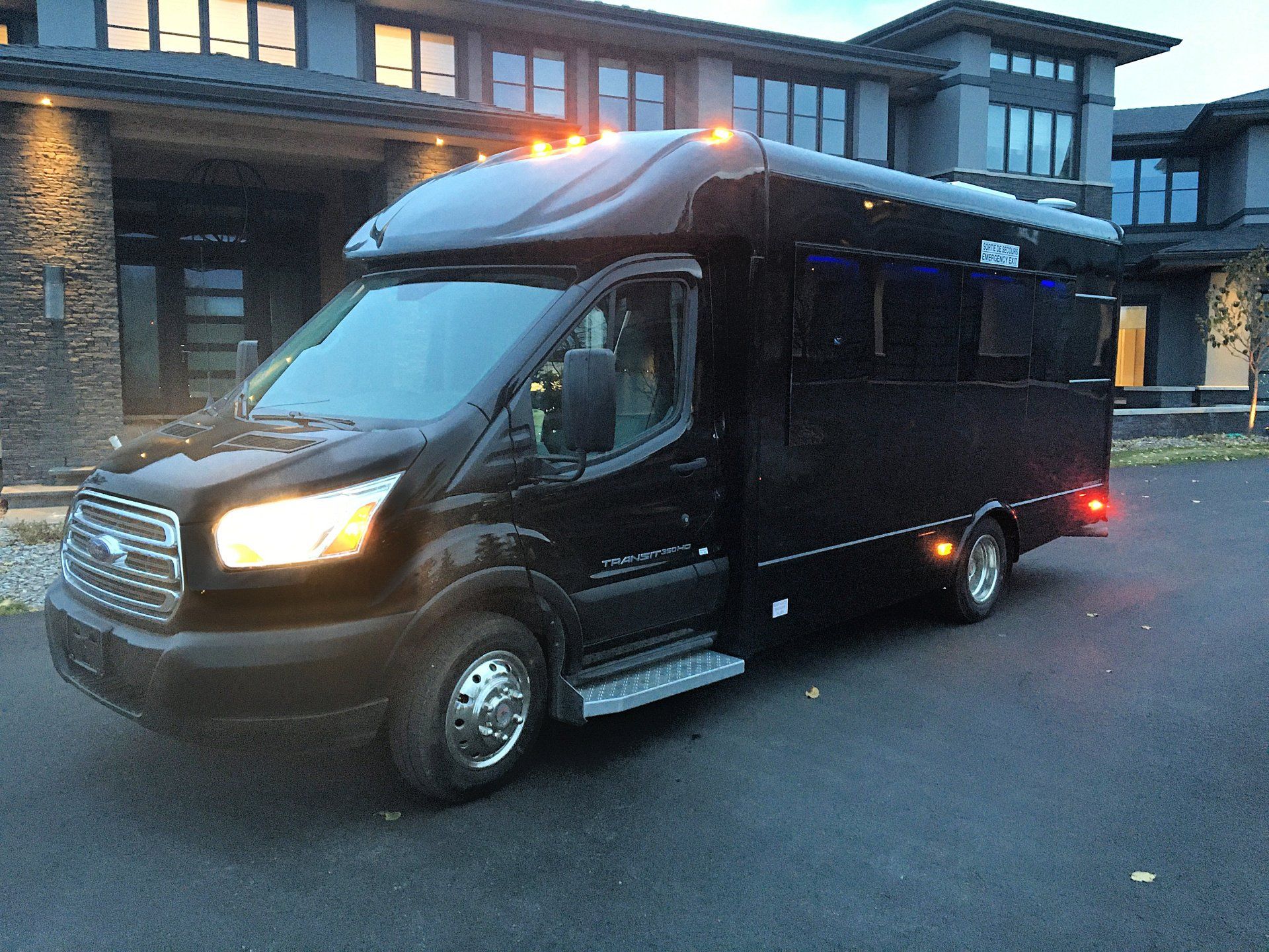 Limo To Go black Battisti Transit 12 passenger party limo bus