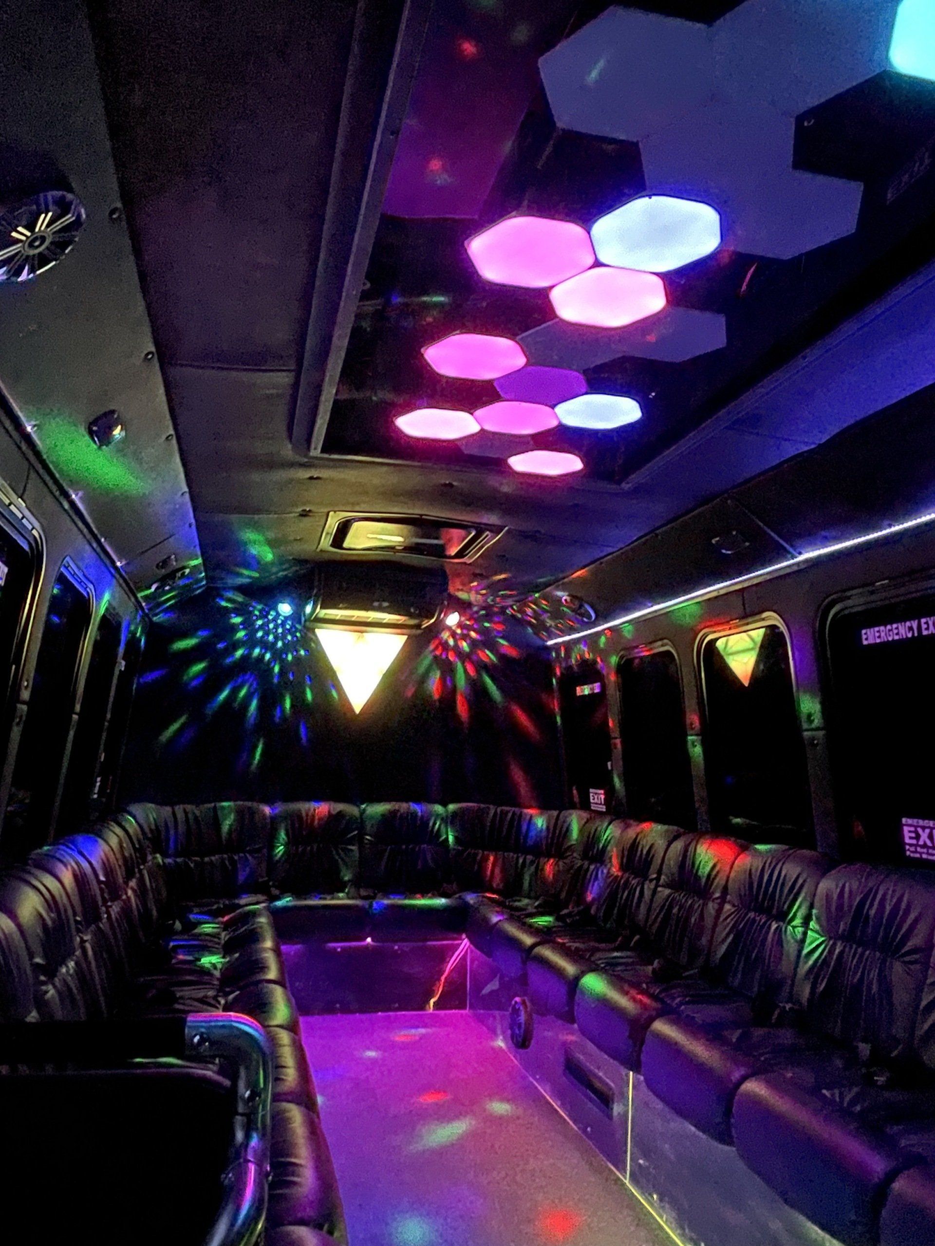The inside of a limousine with a lot of lights on the ceiling.