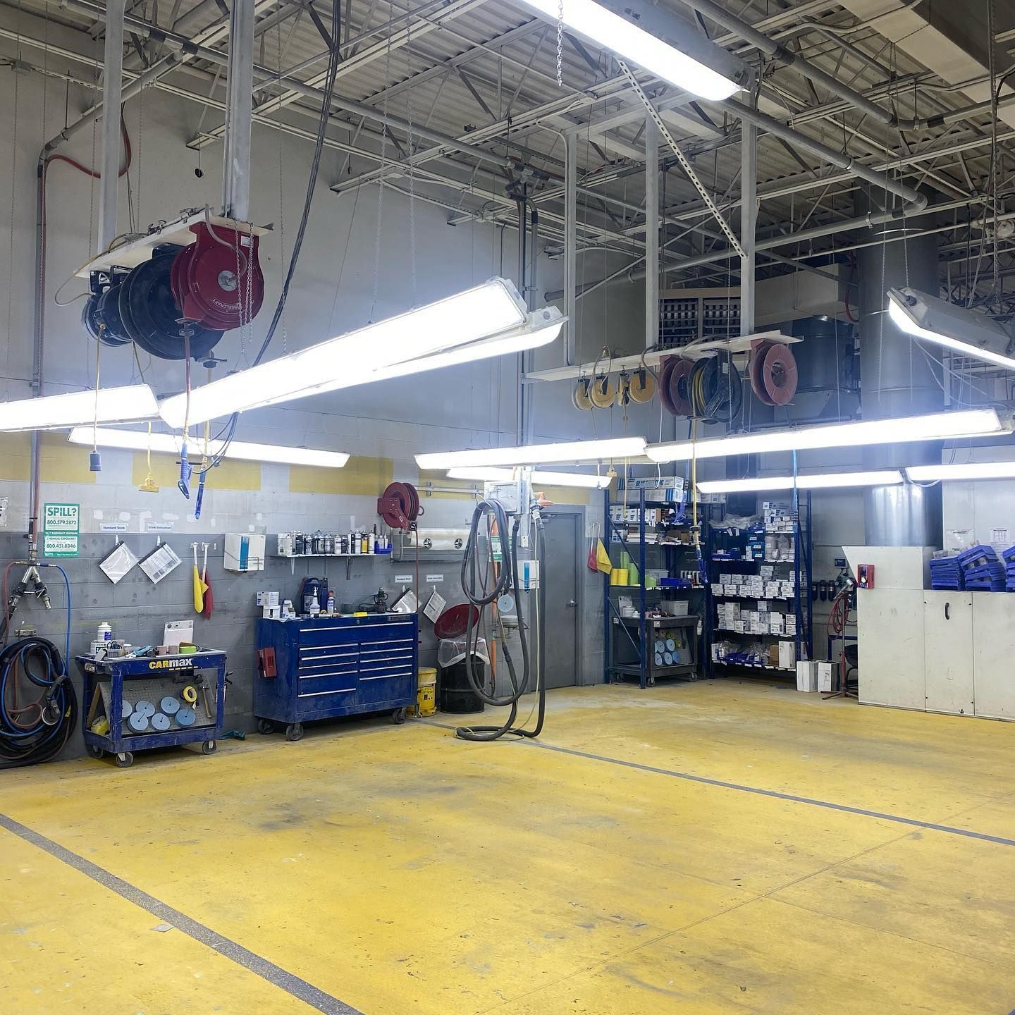 A large garage with a lot of tools on the floor