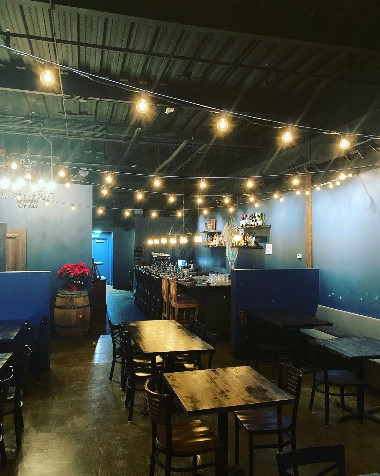 A restaurant with a lot of tables and chairs