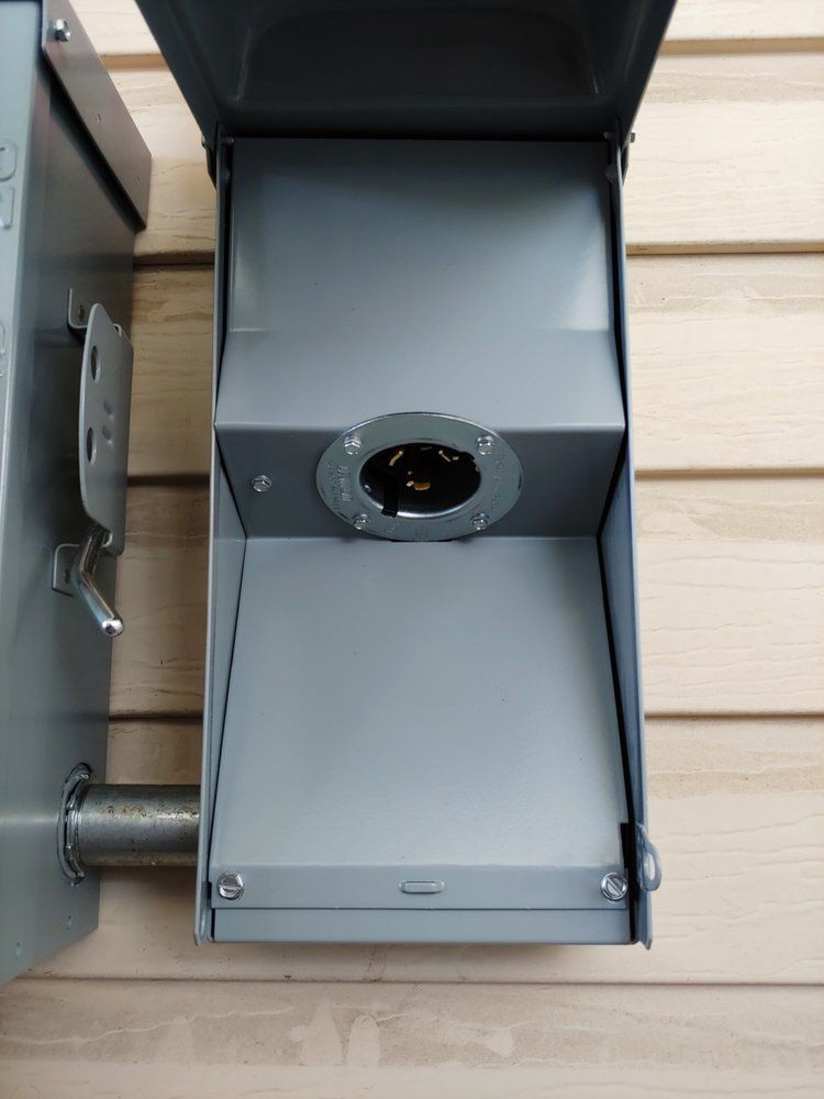 A gray box with a hole in the middle of it
