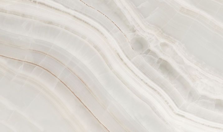 White marble-like surface with soft gray wavy veining