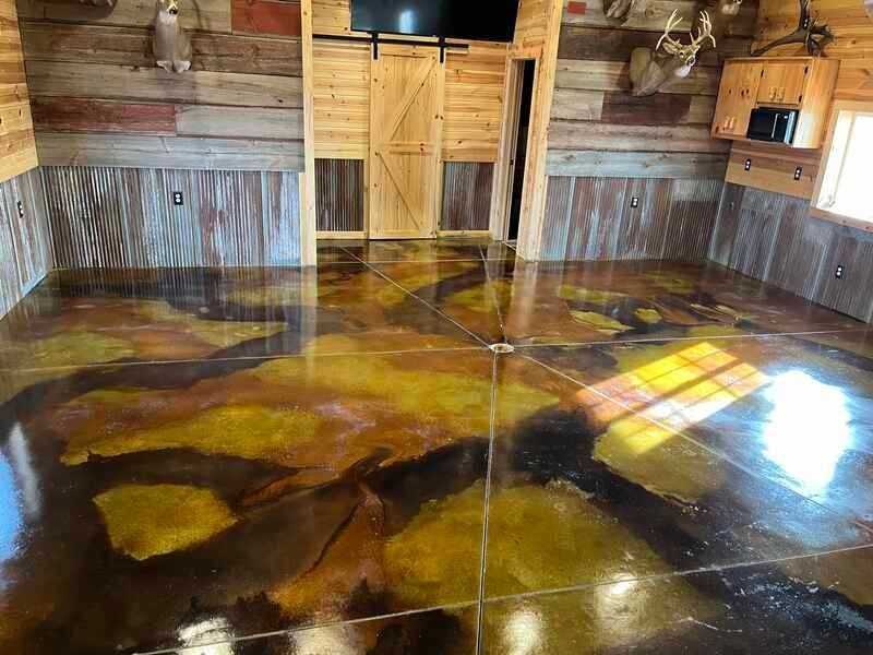 Rustic wooden room with glossy epoxy floor reflecting sunlight through windows