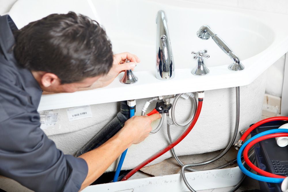 Plumber Fixing Sink