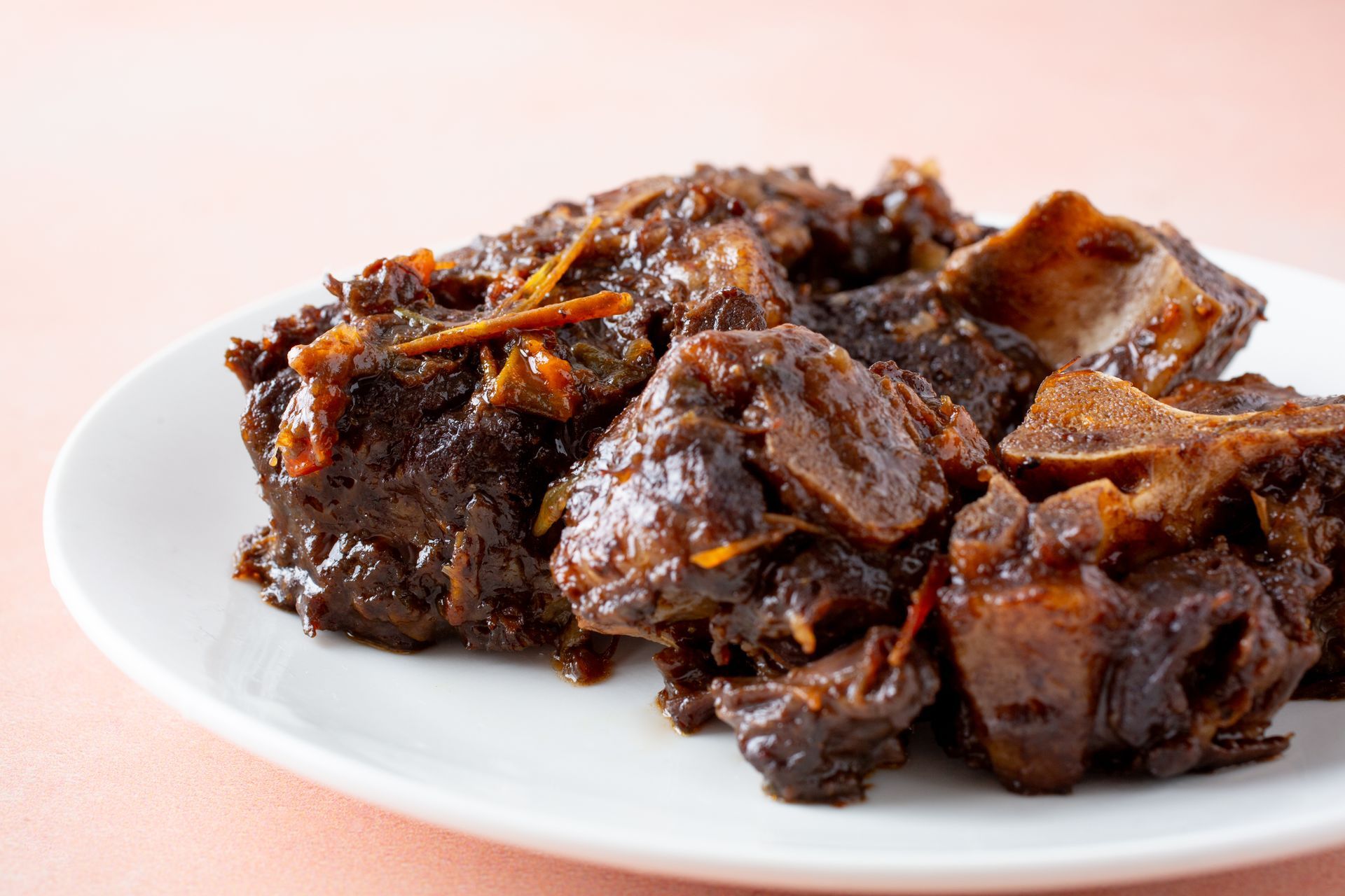 Slow-simmered Caribbean stew chicken cooking on the stovetop at Caribbean Vibes Home Cooking in Howell NJ