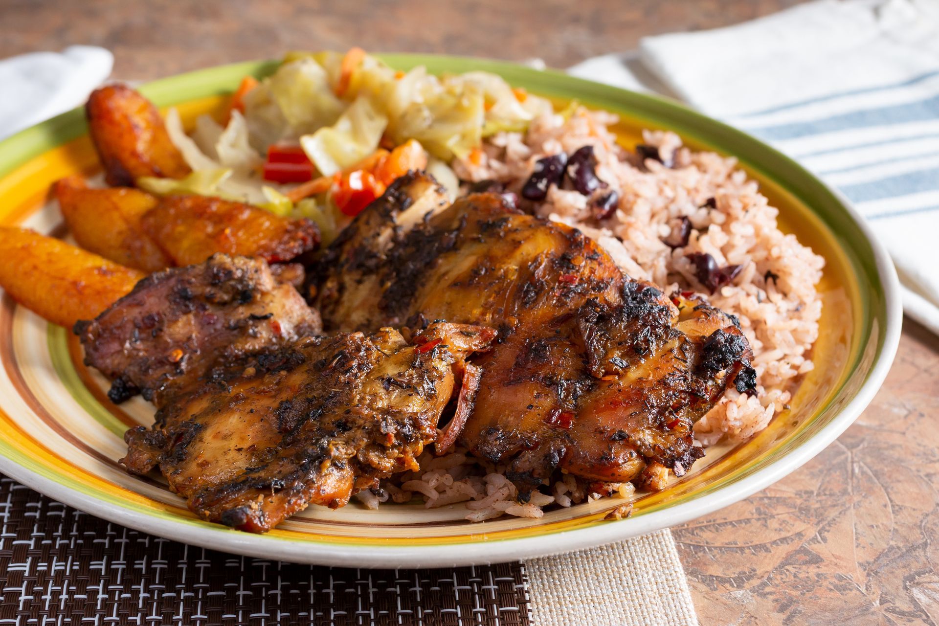 Charred jerk chicken with rice and peas