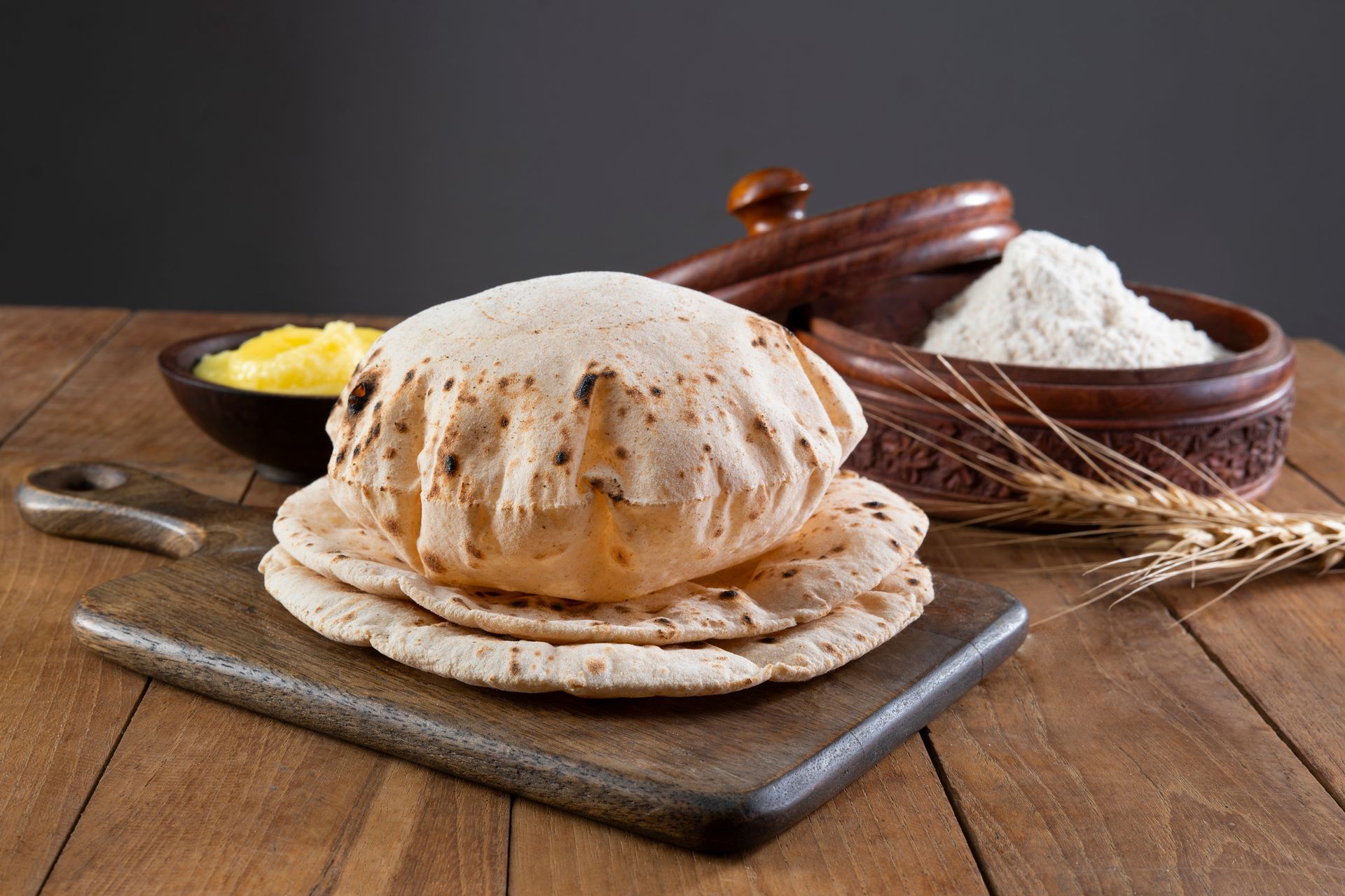 Freshly made roti on a wooden board