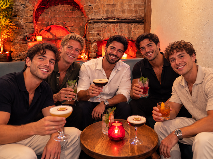Friends enjoying cocktails in the Loft Bar during the week