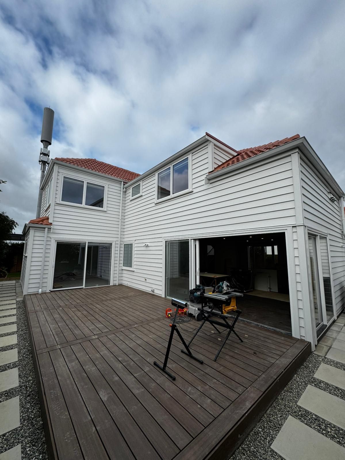 Two-story home exterior painting in Remuera