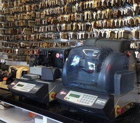 Image of interior of store with key making machine. Photo for Advance Lock and Key, locksmith, Staten Island, NY.