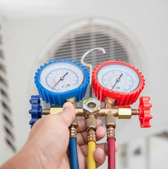 Technician Checking Refrigerant Levels — Summerville, SC — Carolina Air Care