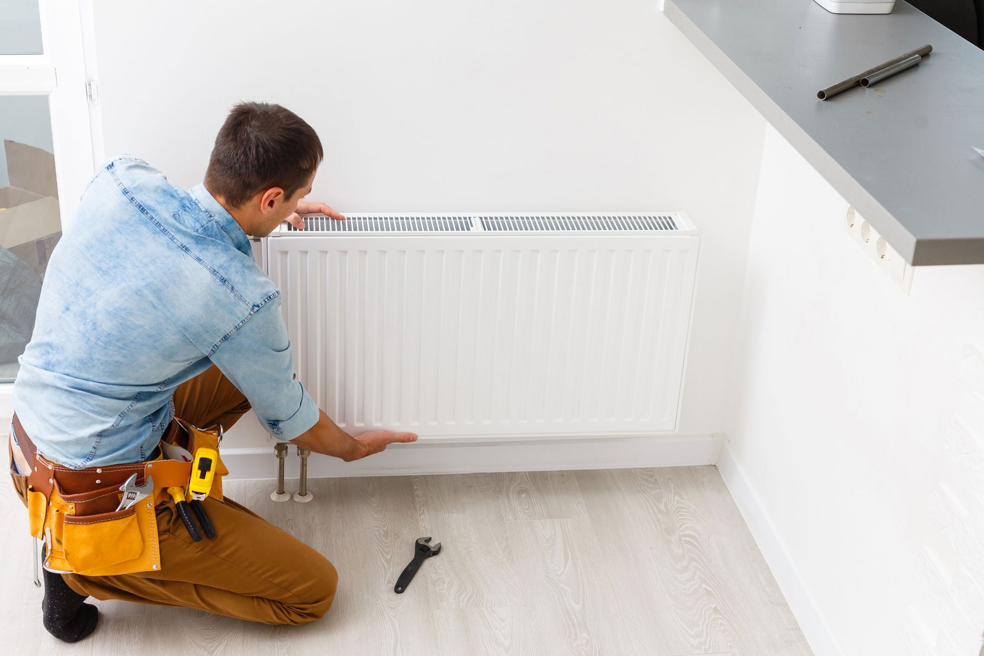Technician Repairing Heating System — Summerville, SC — Carolina Air Care Technician Repairing Heating System — Summerville, SC — Carolina Air Care