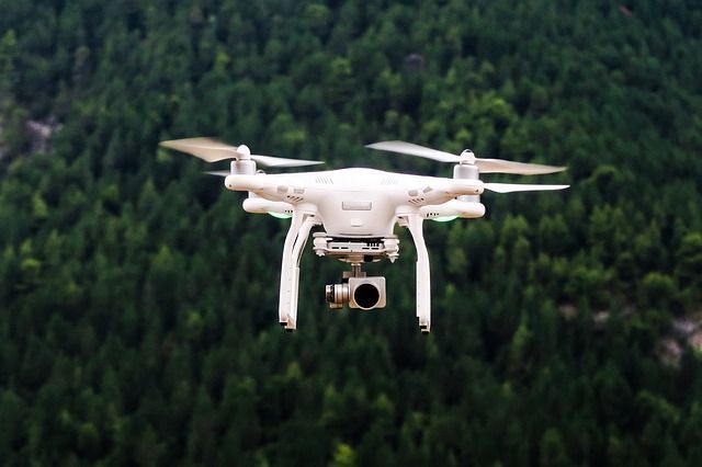 A drone is flying over a forest