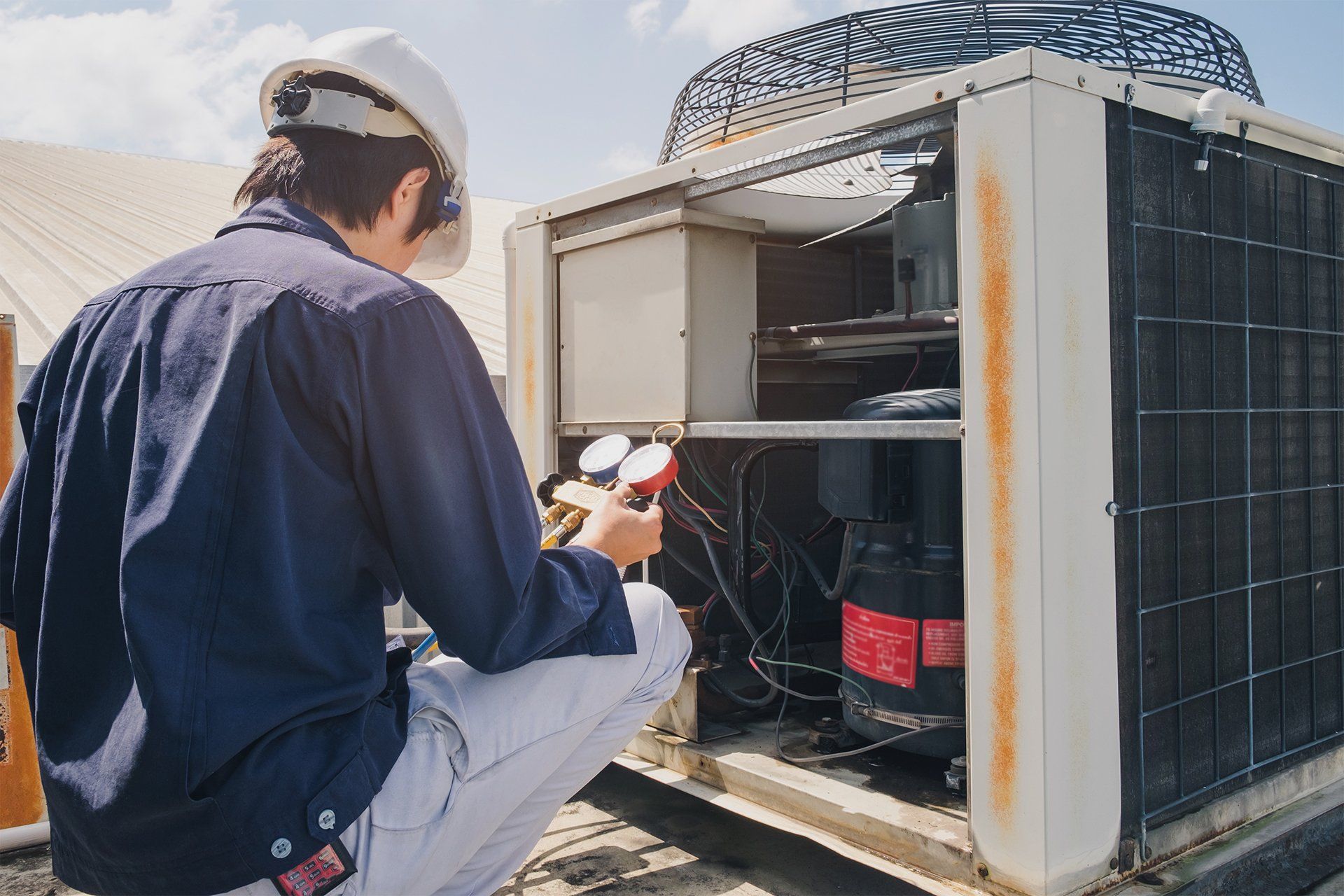 Technician Checking an Air Conditioner