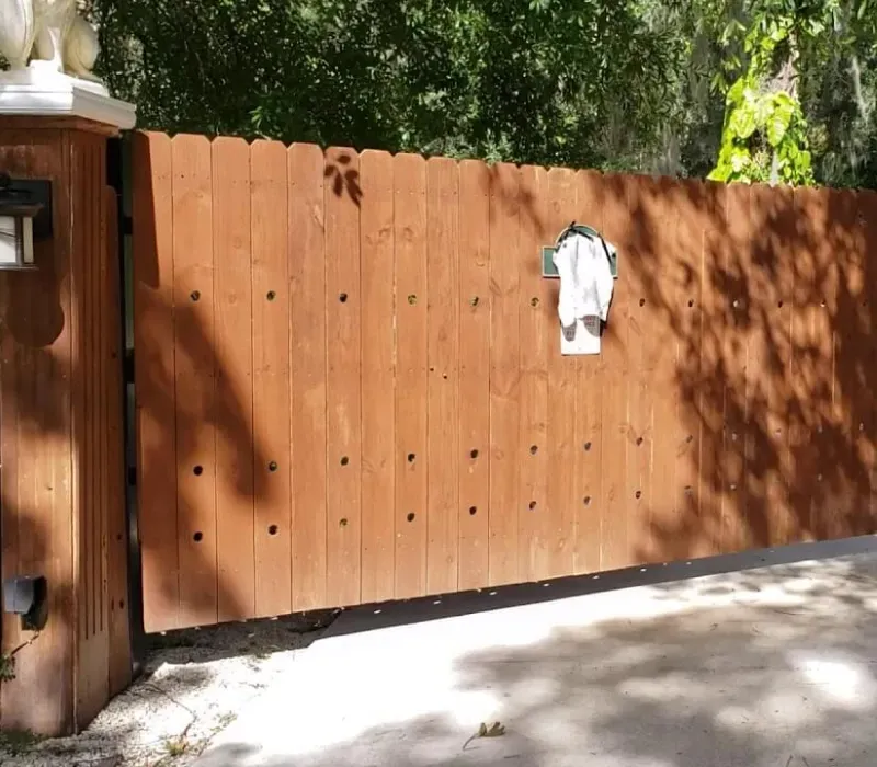 A wooden fence with the letter w on it