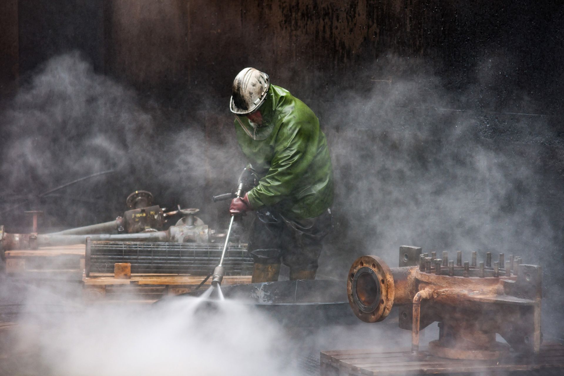 An Aqua Assets team member conducting high pressure water jetting.