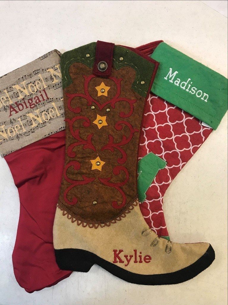 Three Christmas stockings: one red with