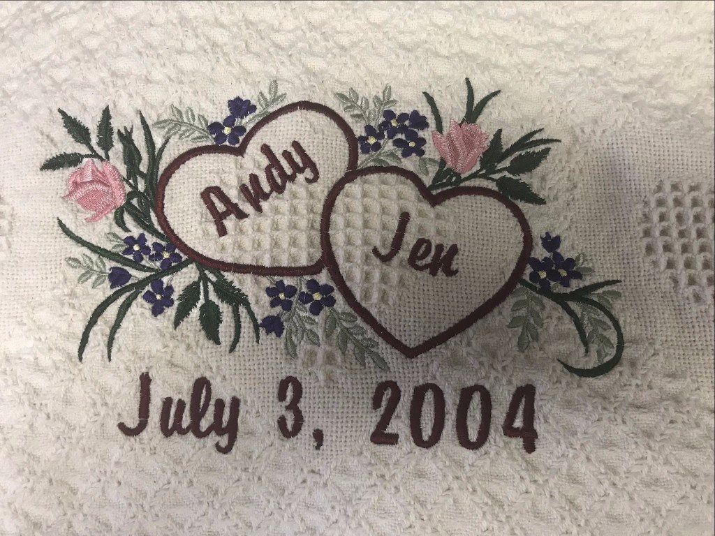 Embroidered hearts on white fabric, personalized with