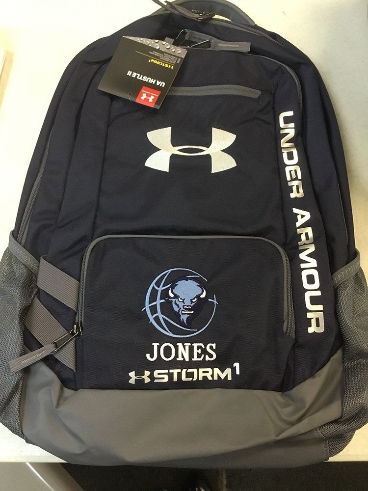 A navy blue and grey Under Armour backpack with a custom logo of a bison, the name