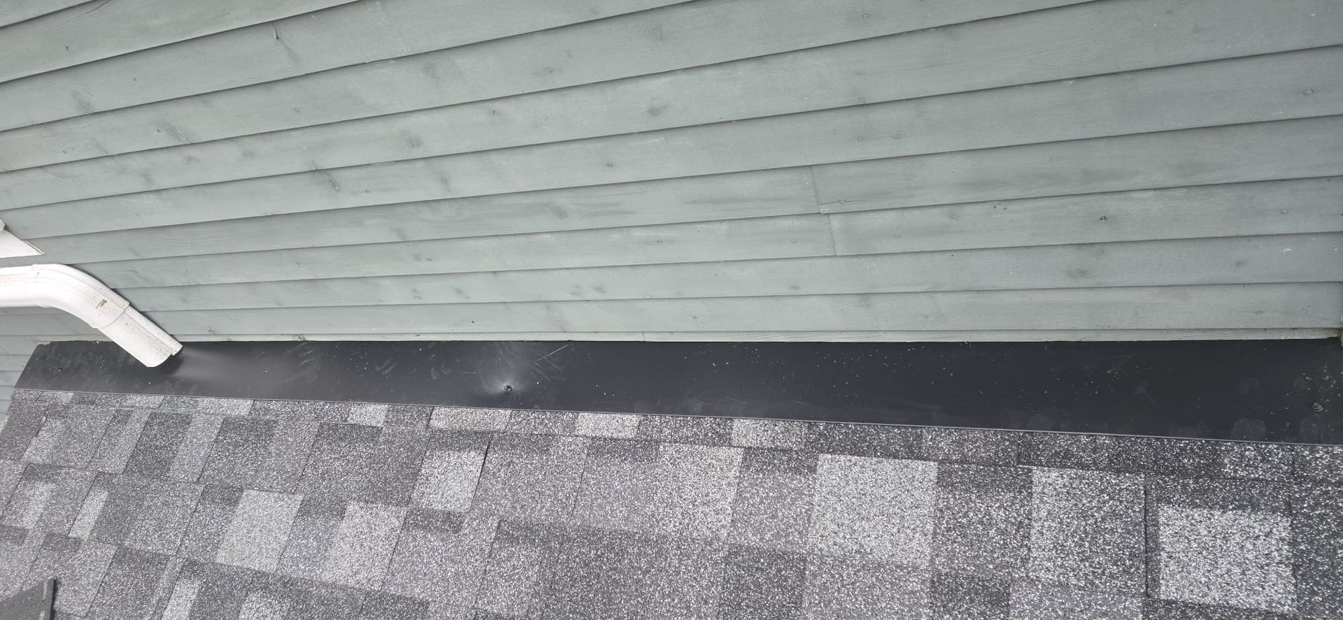 New black aluminum drip edge installed along eave on Vancouver roof replacement, Paragon Roofing BC