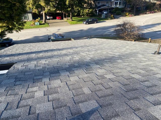 Architectural asphalt shingles above a residential street